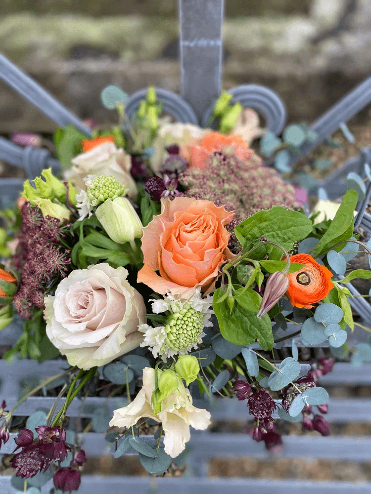 A small seasonal arrangement styled inside the florist studio.